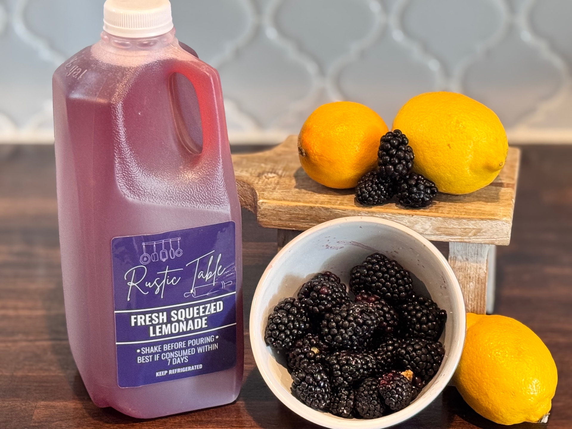 Blackberry lemonade with fresh berries and lemons